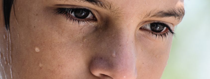 young boy sweating