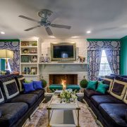Living room with fireplace burning