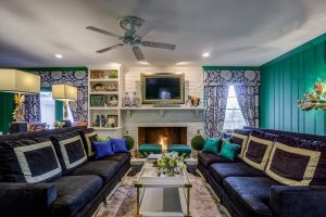 Living room with fireplace burning